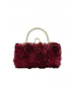 Pochette opulente avec poignée en strass rose en bordeaux