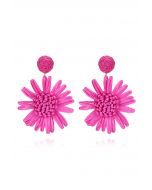 Boucles d'oreilles tissées à la main en raphia tournesol en magenta