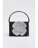 Sac à main en satin orné de roses radieuses en noir